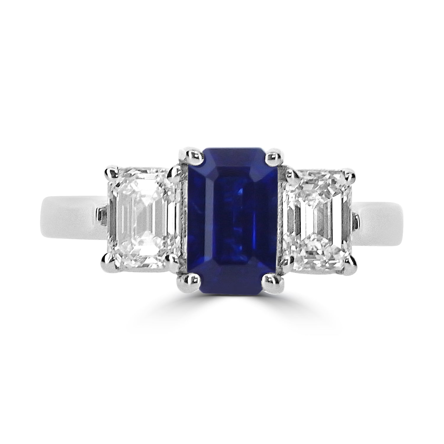 0.40CT EMERALD CUT SAPPHIRE AND PRINCESS DIAMOND THREE STONE ENGAGEMENT RING- HARROGATE