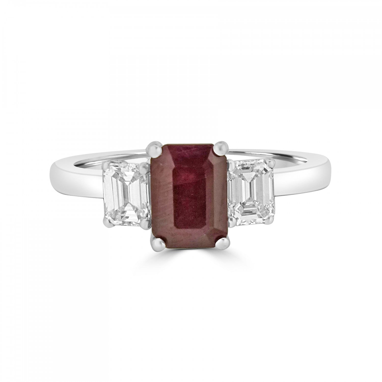 Emerald cut ruby three stone diamond engagement ring from fogal and barnes fine jewellers of harrogate set on platinum or 18k gold.