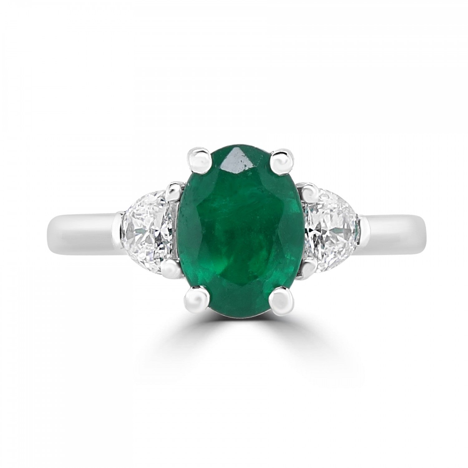 Oval cut natural emerald with 2 halfmoon diamonds three stone engagement ring from fogal and barnes fine jewellers of harrogate