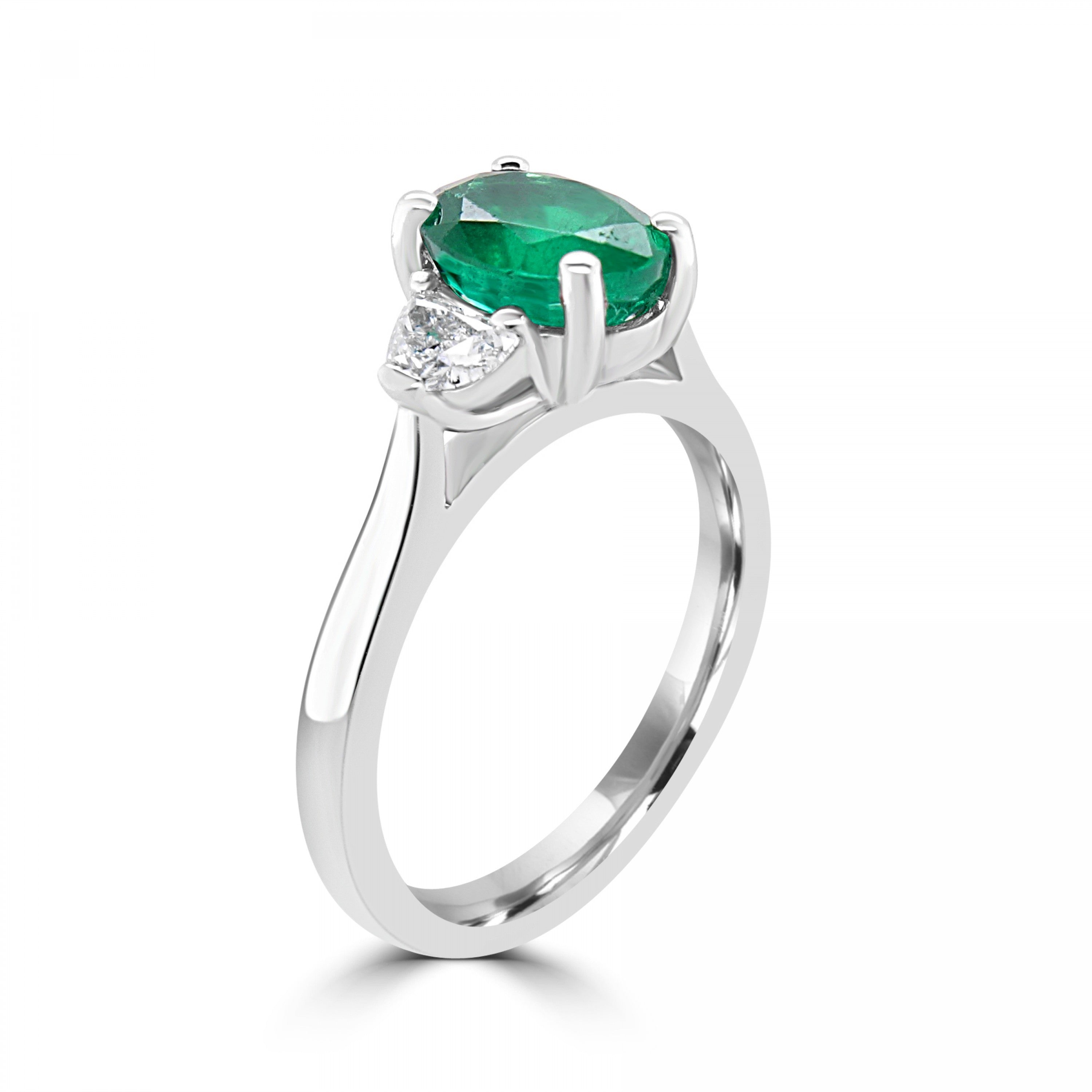 Oval cut natural emerald with 2 halfmoon diamonds three stone engagement ring from fogal and barnes fine jewellers of harrogate