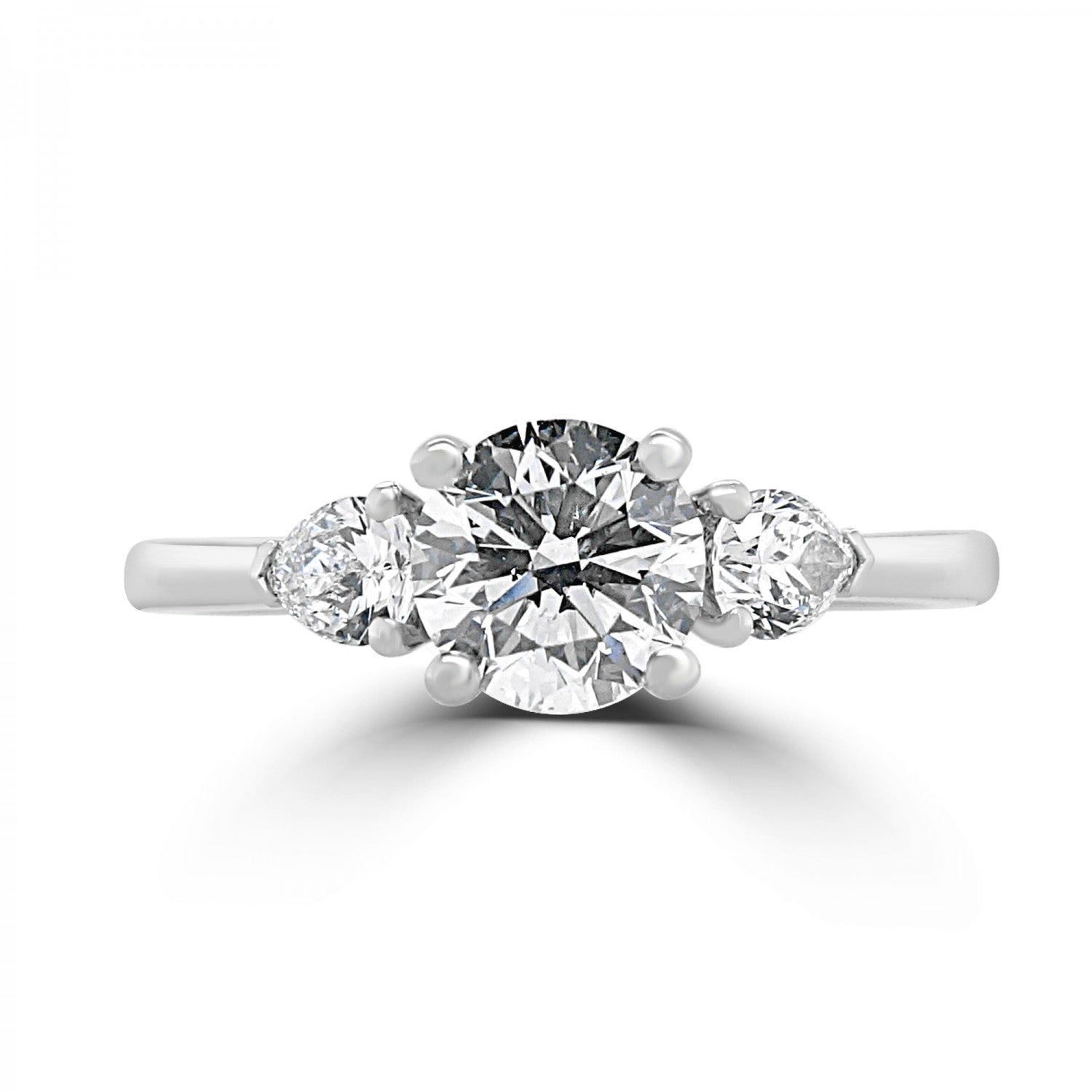 Round brilliant diamond and pear side three stone engagement ring harrogate. from fogal and barnes.