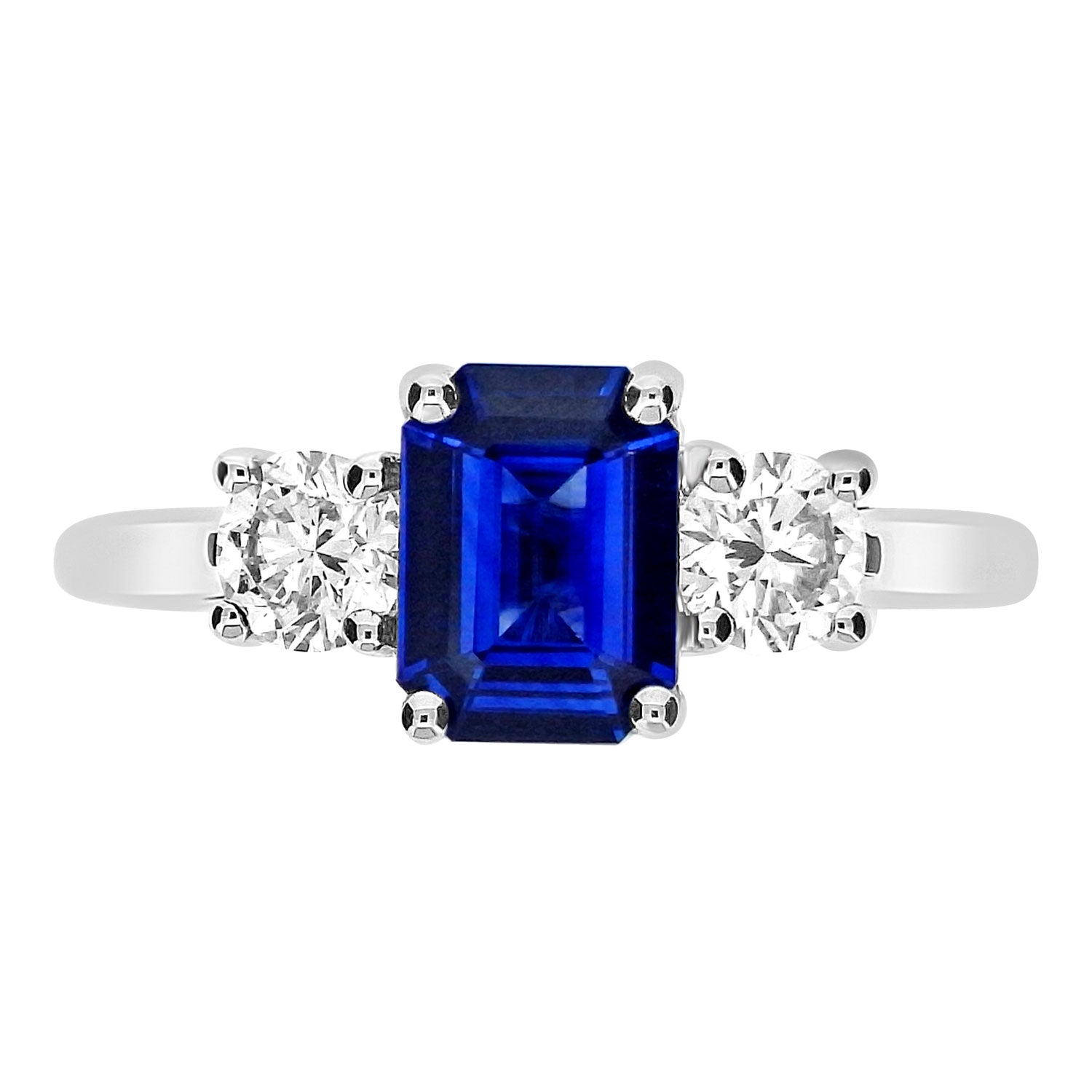 Emerald cut sapphire and round brilliant diamonds on each side. froom fogal and barnes fine jewellers of harrogate.