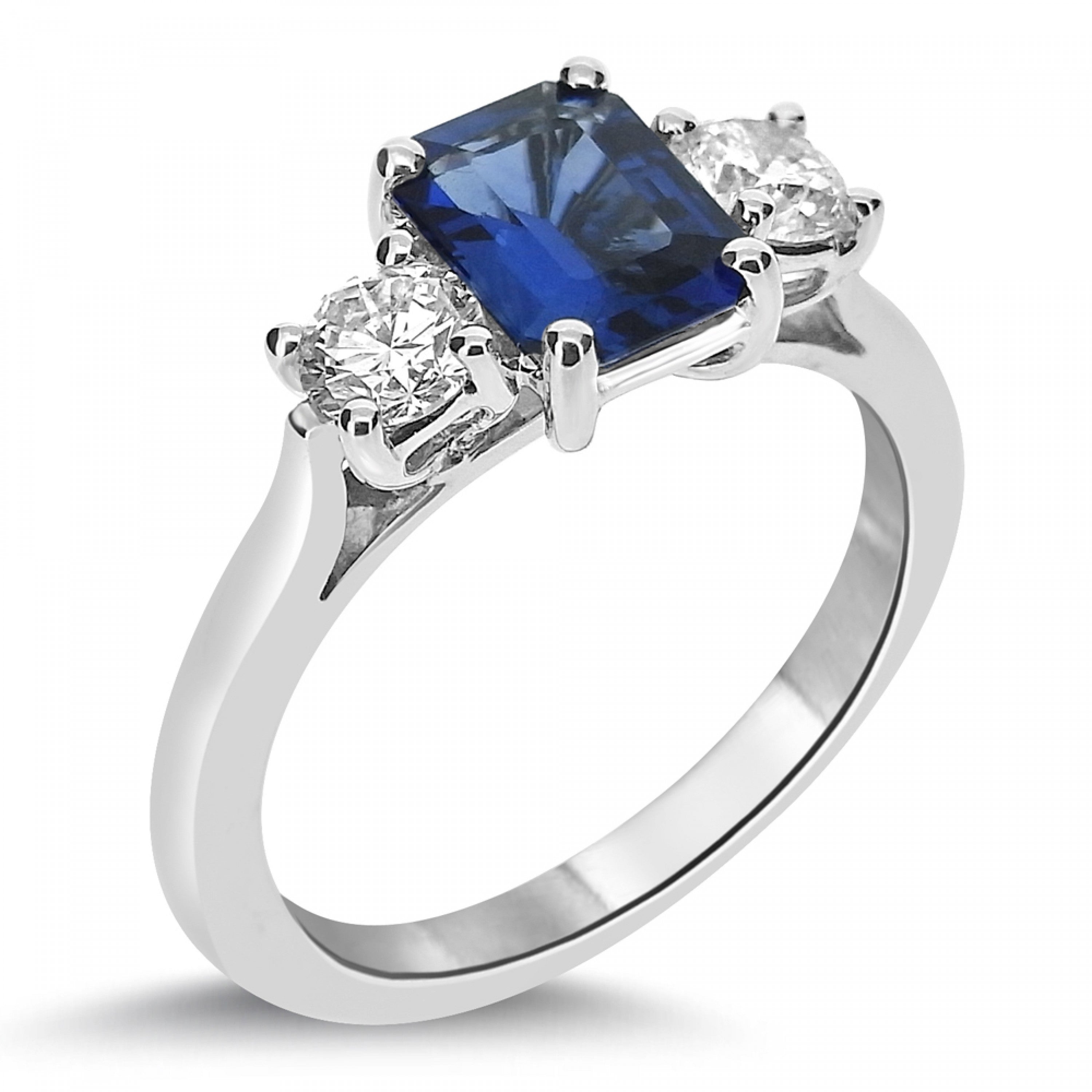 Emerald cut sapphire and round brilliant diamonds on each side. froom fogal and barnes fine jewellers of harrogate.