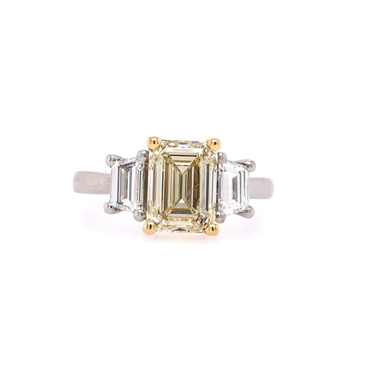 Emerald cut yellow diamond center trilogy engagement ring Harrogate 2 x side Emerald cut diamond set on platinum with an 18ct yellow gold head two tone band Fogal and Barnes Fine Independent Jewellers