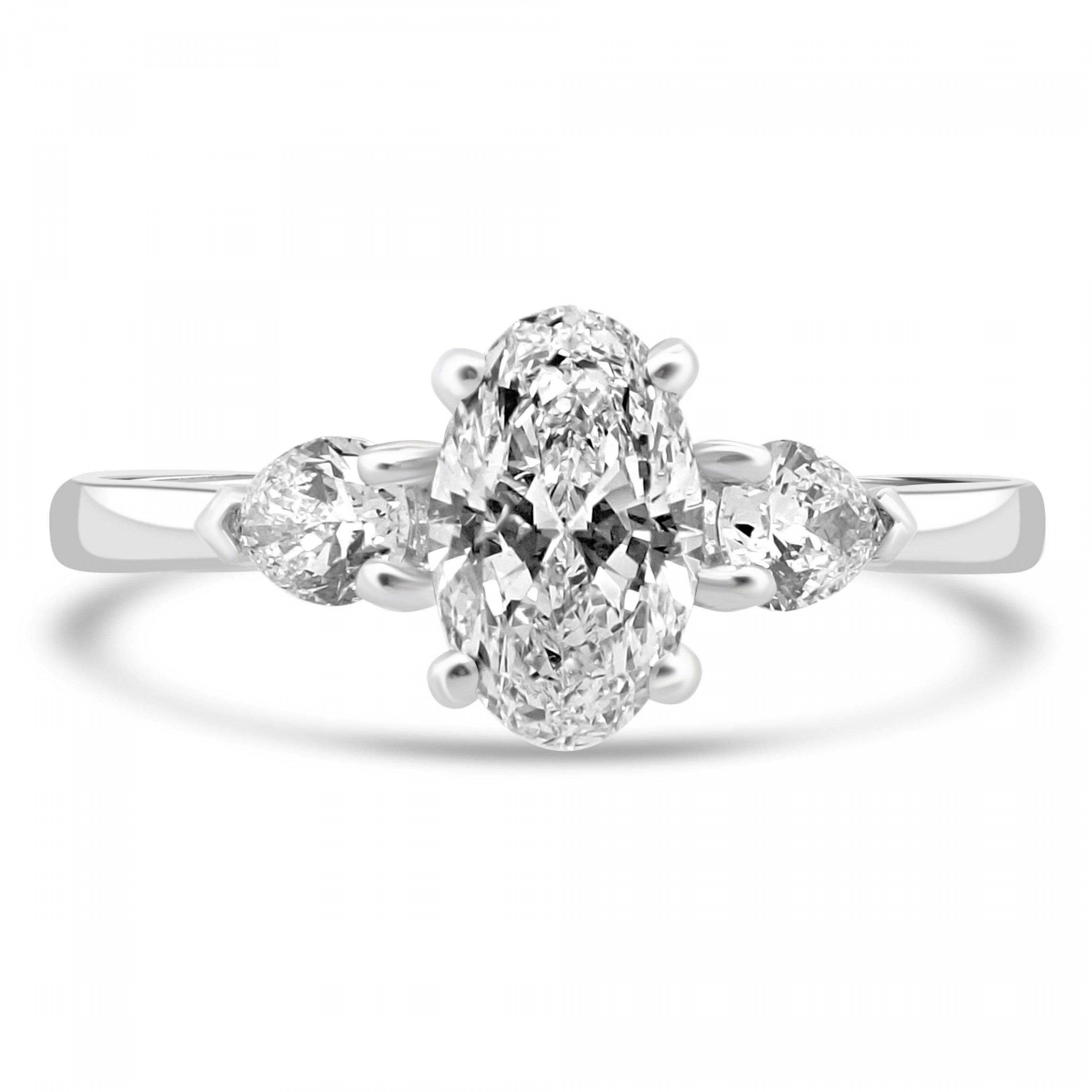 Oval diamond center with 2 side pear diamonds three stone engagement ring from fogal and barnes fine jewellers of harrogate