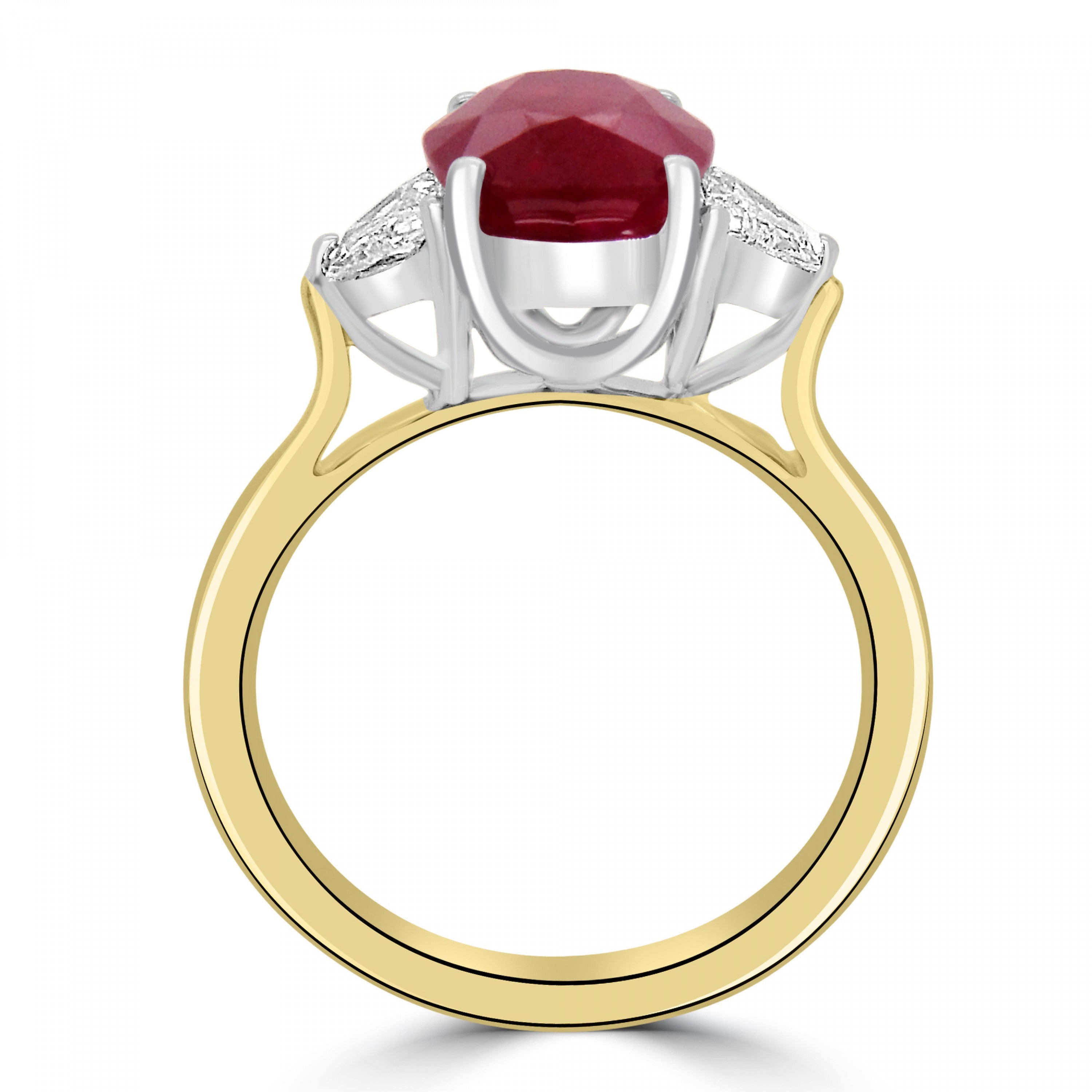 Oval cut ruby and diamond three stne engagement ring from fogal and barnes fine jewellers of harrogate. set on 18 k yellow gold and platinum head.
