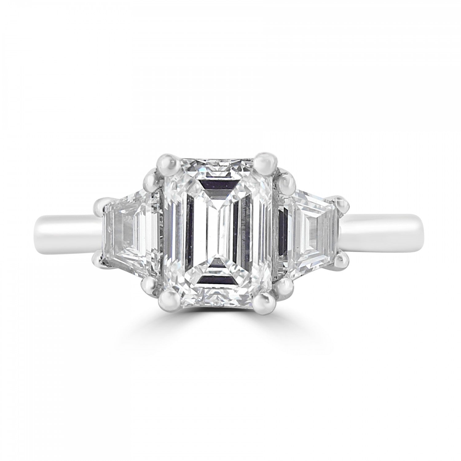 Emerald cut three diamond engagement ring set on platinum from fogal and barnes fine jewellers of Harrogate
