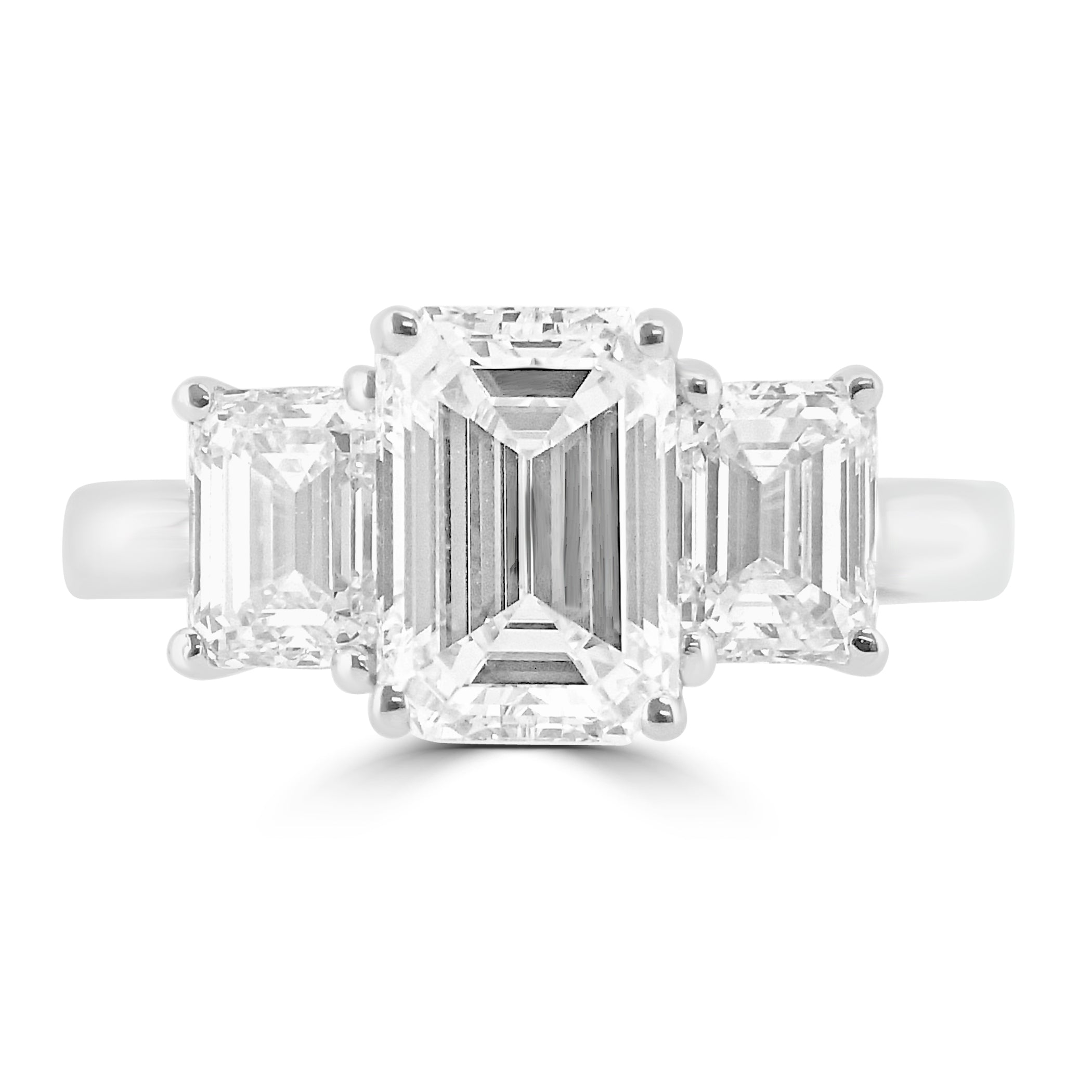 Emerald cut diamond three stone engagement ring set on platinum from fogal and barnes fine jewellers of harrogate