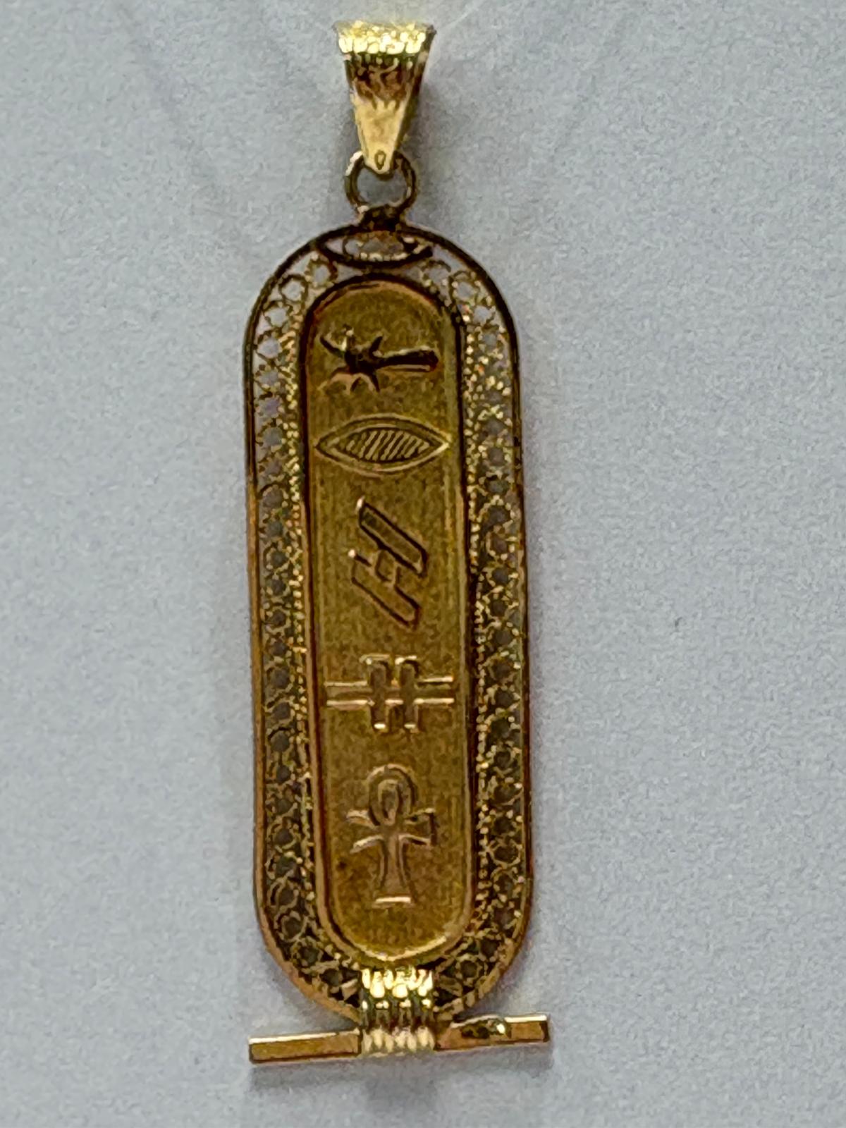 Vintage Egyptian 18ct yellow gold cartouche pendant with hieroglyphic engravings including ankh symbol and intricate filigree border, 3.96g, shown front and back and worn on neck, available at Fogal & Barnes Harrogate