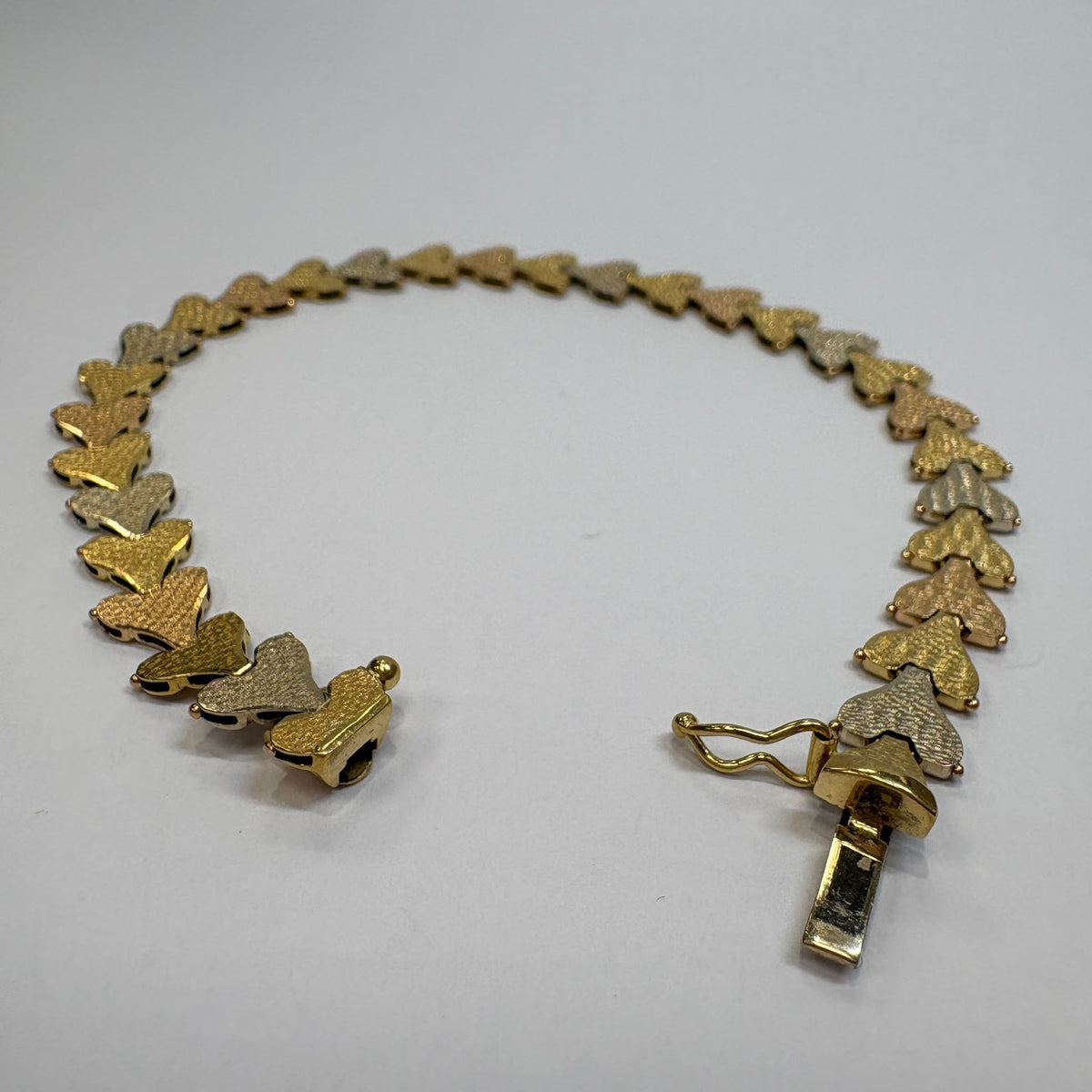 18ct gold heart bracelet, tri-colour gold bracelet, heart link bracelet UK, pre-loved 18ct gold bracelet, anniversary bracelet gold, rose gold heart bracelet, three colour gold bracelet, second hand gold bracelet