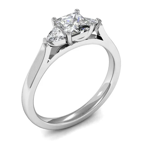 Princess cut diamond Trilogy engagement ring with 2 pear cut diamonds Set on 18k white gold fogal and barnes fine jewellers of harrogate independent jewellers.