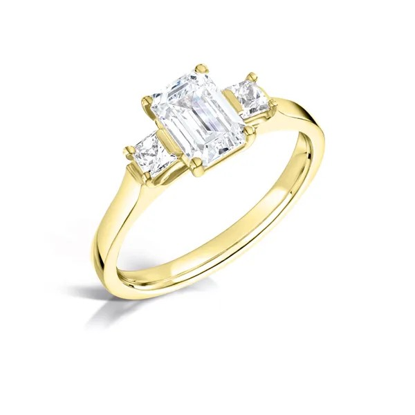 Emerald cut diamond and princess three stone engagement ring set on 18k yellow gold from fogal and barnes fine jewellers of Harrogate