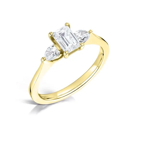 Emerald cut diamond center with 2 diamond pears on the sides set on 18k yellow gold from fogal and barnes fine jewellers of harrogate