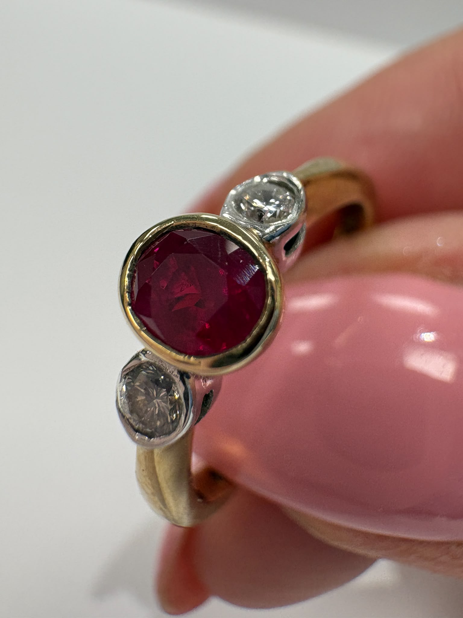 ruby and diamond ring, bezel set ruby ring, two tone gold ruby ring, second hand ruby ring UK, pre-loved three stone ring, vintage ruby diamond ring, 9ct gold ruby ring, ruby diamond trilogy ring, second hand jewellery Harrogate, second hand jewellery Leeds, second hand jewellery York, second hand jewellery Yorkshire, pre-owned ruby ring UK, bezel set gemstone ring, buy second hand ruby ring, ruby ring size N, ruby ring near me, fine jewellery Harrogate, pre-loved jewellery Yorkshire