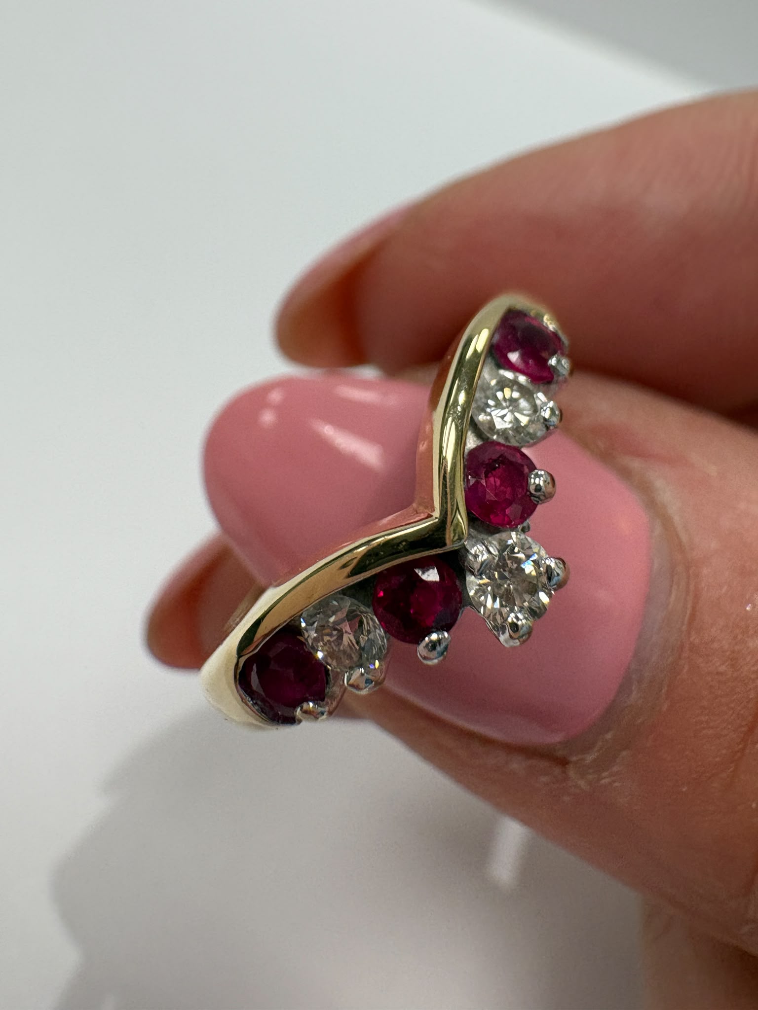 ruby and diamond wishbone ring, chevron ring ruby diamond, natural ruby ring UK, second hand wishbone ring, pre-loved ruby ring, vintage wishbone ring, 9ct gold ruby diamond ring, ruby diamond stacking ring, wishbone wedding ring, second hand jewellery Harrogate, second hand jewellery Leeds, second hand jewellery York, second hand jewellery Yorkshire, pre-owned natural ruby ring UK, natural diamond wishbone ring, unique ruby ring, buy second hand wishbone ring, wishbone ring size N, ruby ring near me, fine