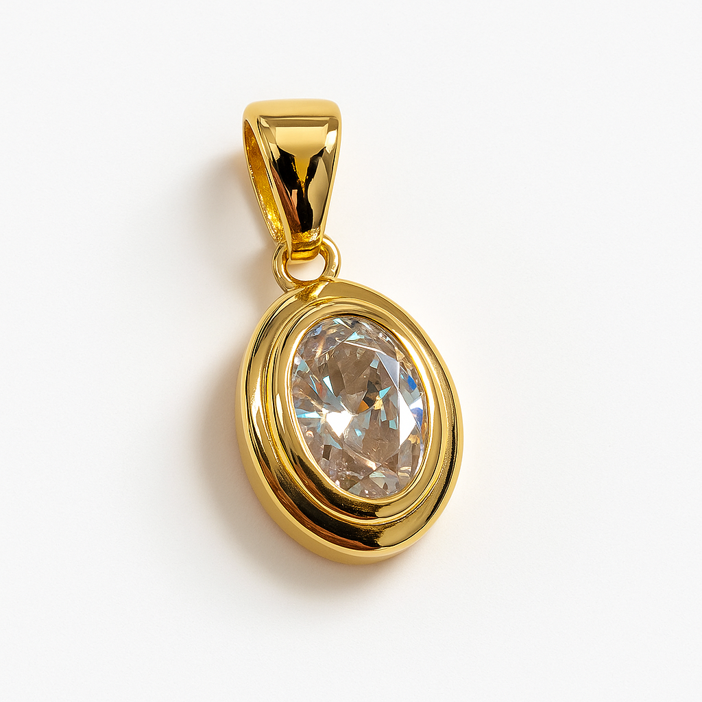 Gold pendant with a clear gemstone on a white background harrogate