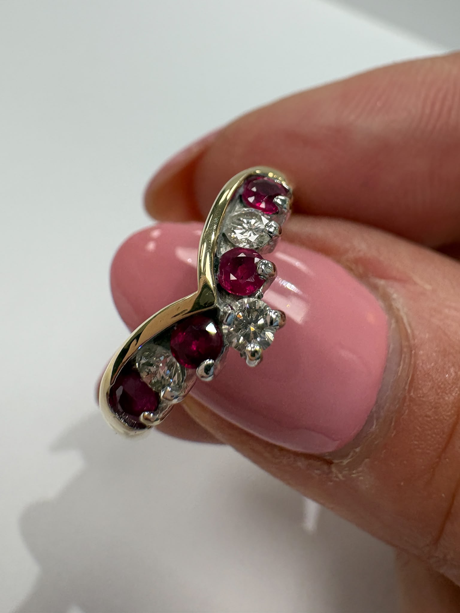 ruby and diamond wishbone ring, chevron ring ruby diamond, natural ruby ring UK, second hand wishbone ring, pre-loved ruby ring, vintage wishbone ring, 9ct gold ruby diamond ring, ruby diamond stacking ring, wishbone wedding ring, second hand jewellery Harrogate, second hand jewellery Leeds, second hand jewellery York, second hand jewellery Yorkshire, pre-owned natural ruby ring UK, natural diamond wishbone ring, unique ruby ring, buy second hand wishbone ring, wishbone ring size N, ruby ring near me, fine