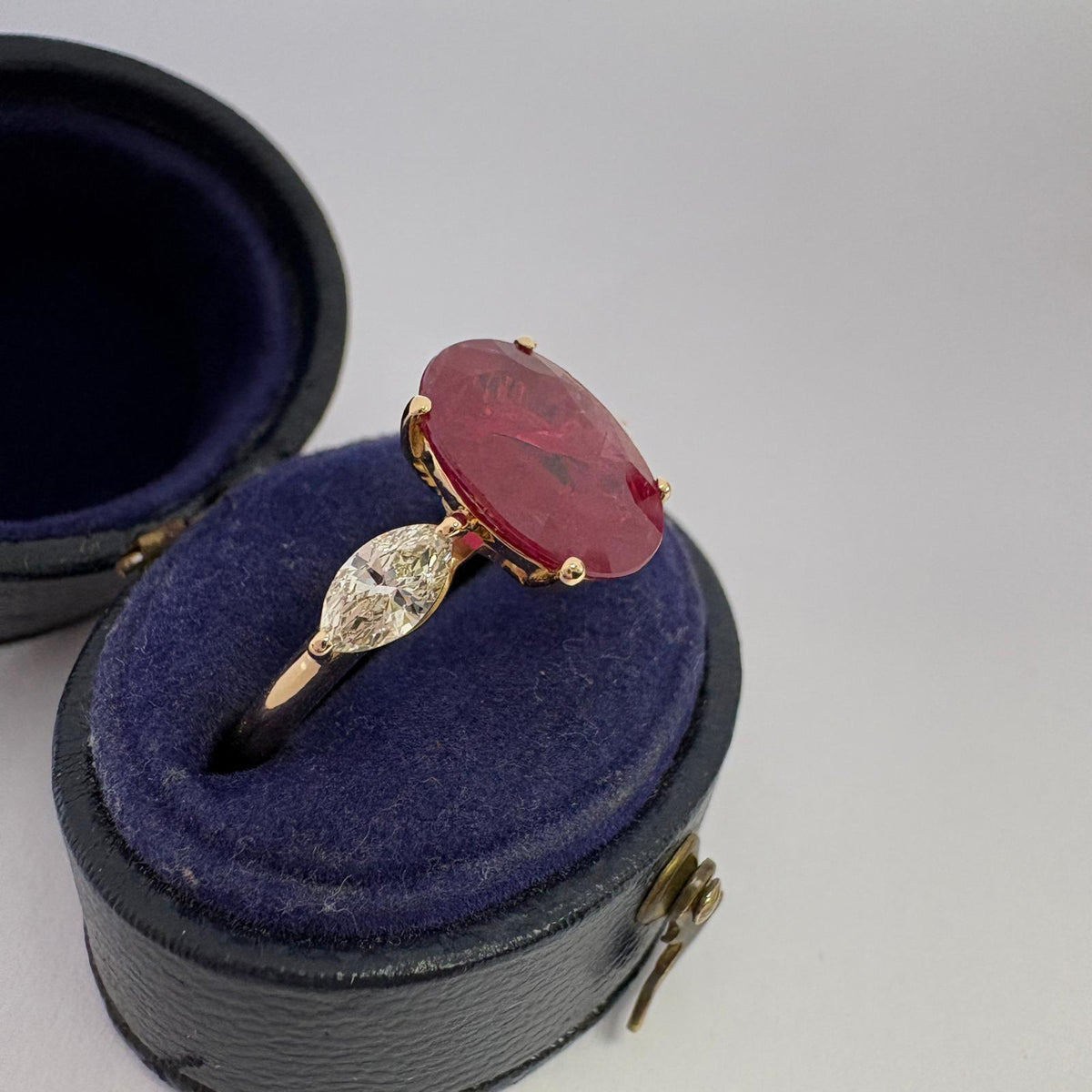 ruby and diamond ring, 3 carat ruby ring, oval ruby ring UK, marquise diamond ring, east west marquise ring, ruby engagement ring, ruby anniversary ring, 18ct gold ruby ring