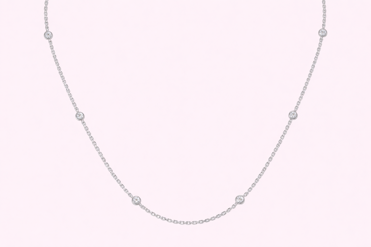 Lab-grown diamond station necklace in yellow gold with bezel-set diamonds along a fine chain, bespoke jewellery by Fogal & Barnes Harrogate