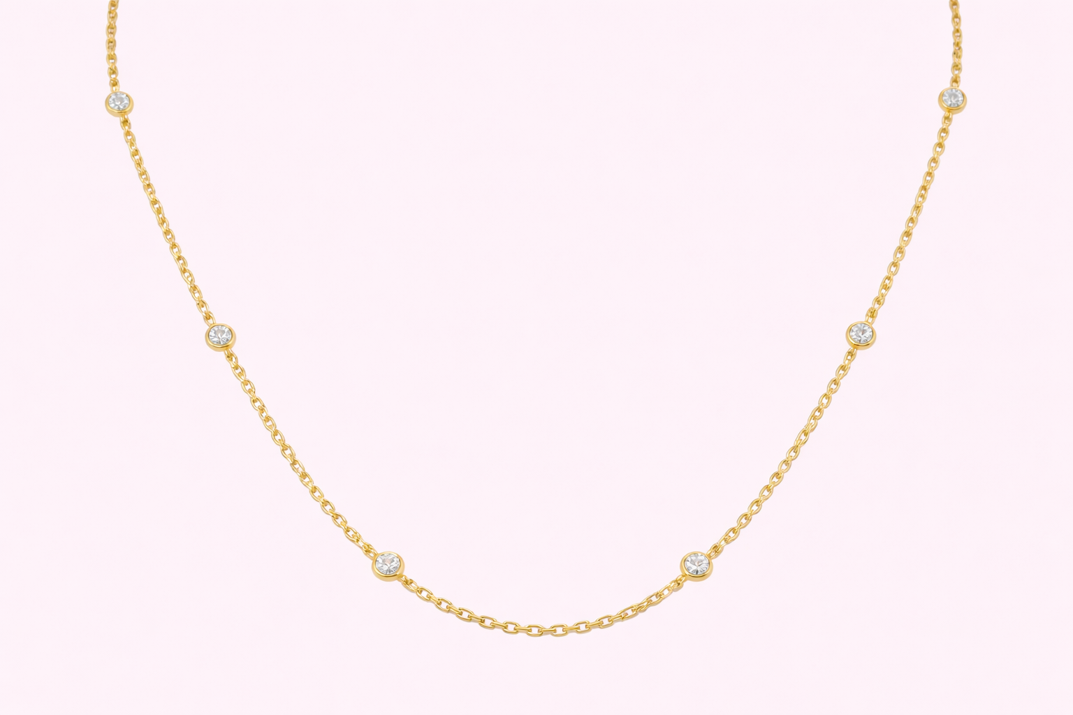 Lab-grown diamond station necklace in yellow gold with bezel-set diamonds along a fine chain, bespoke jewellery by Fogal & Barnes Harrogate