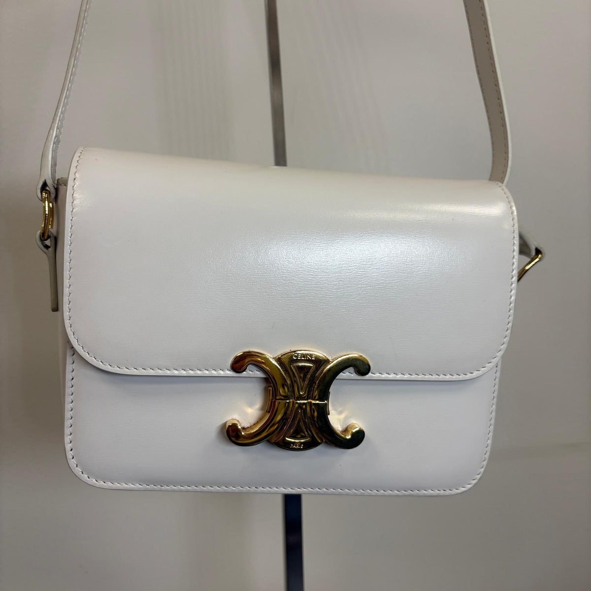 Celine Teen Triomphe, pre-loved Celine bag UK, white Celine Triomphe bag, second hand Celine handbag, Celine Triomphe shoulder bag, Celine crossbody bag, preowned designer handbag UK, Celine shiny calfskin