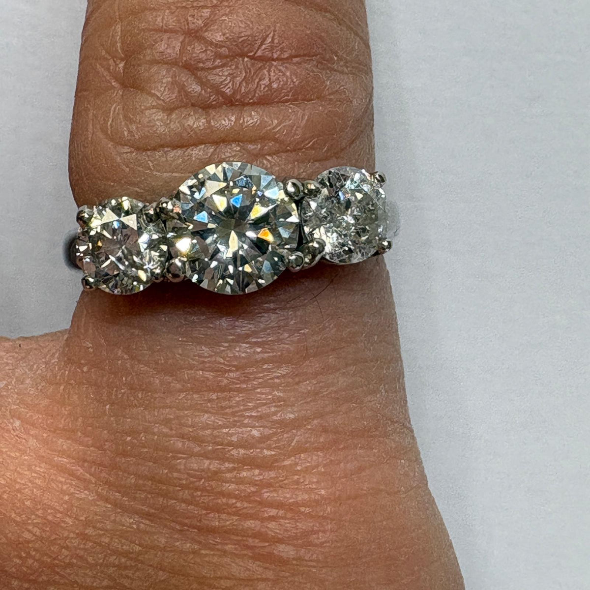 three stone diamond ring, trilogy diamond ring UK, platinum diamond ring, pre-loved engagement ring, second hand diamond ring, 1.5 carat diamond ring, anniversary diamond ring, pre-owned trilogy ring