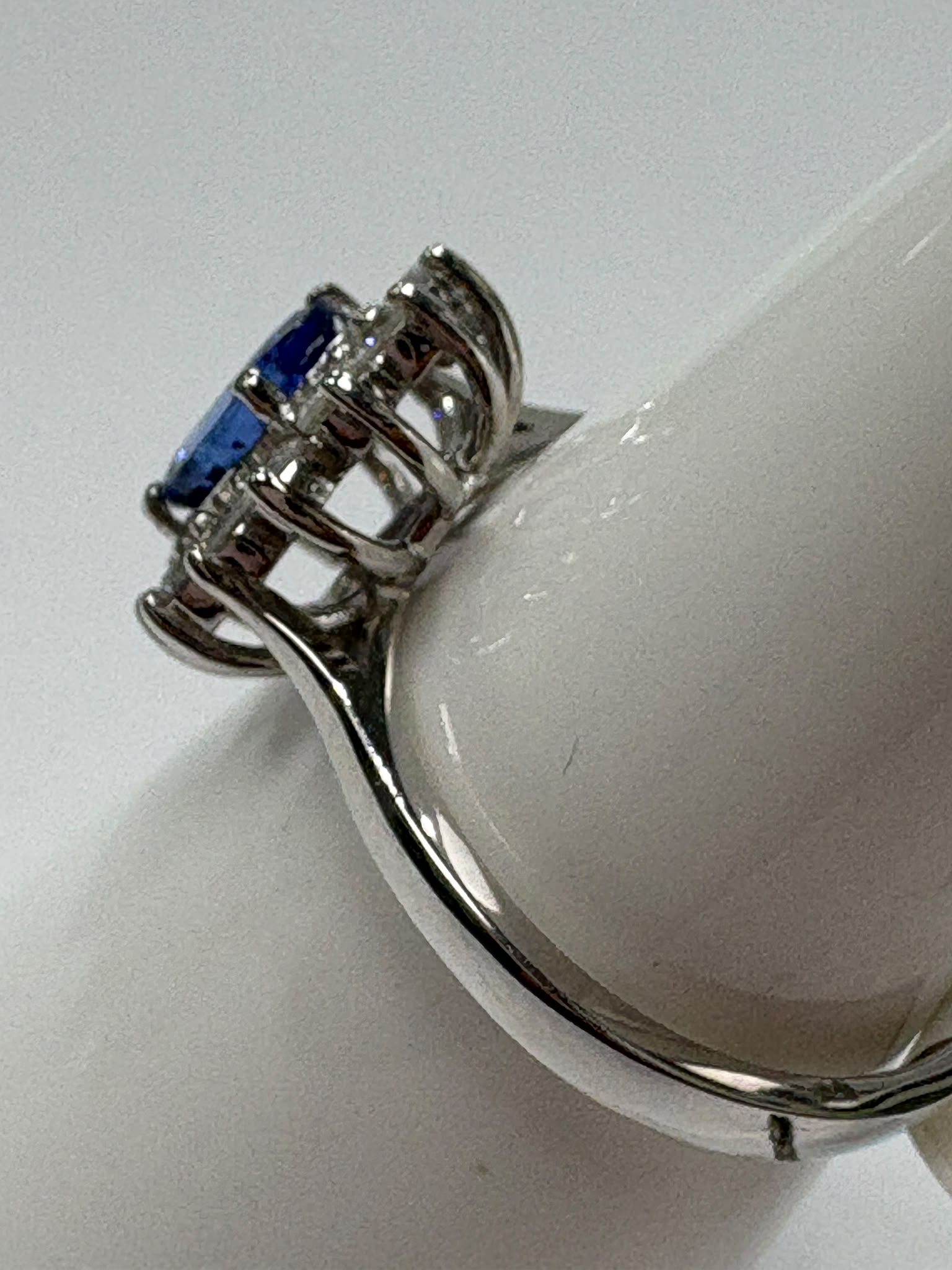 Tanzanite and diamond cluster ring in 9ct white gold, oval tanzanite centre stone