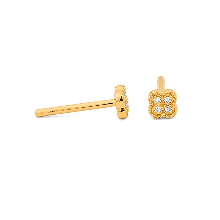 Yellow gold diamond clover stud earrings with milgrain edge detailing and four round brilliant diamonds, side view