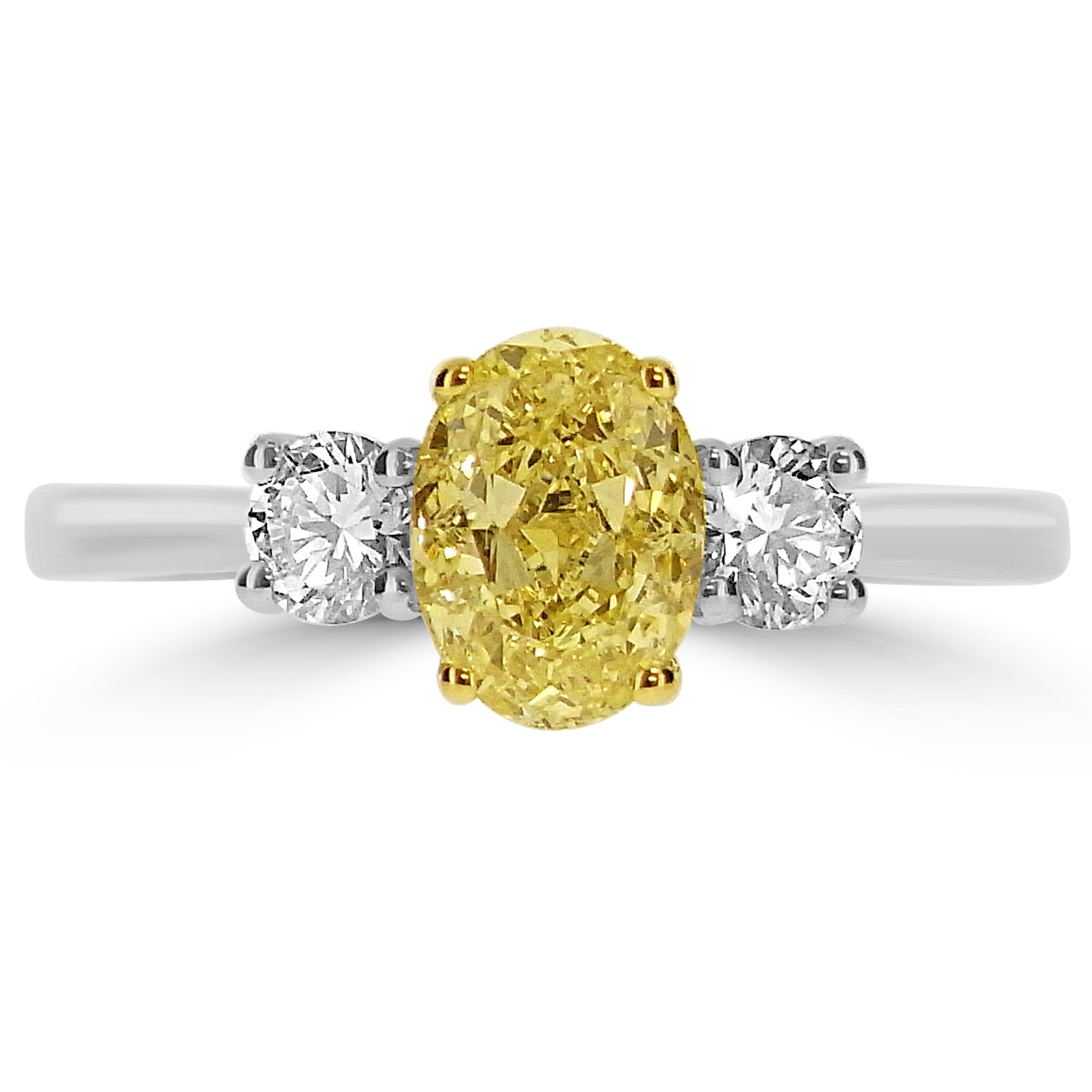 Oval fancy light yellow diamond ring with round brilliant-cut side stones