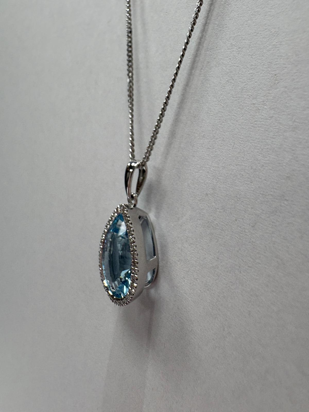 blue topaz diamond pendant, pre-loved white gold necklace, second hand 9ct white gold pendant, topaz halo pendant UK, pre-owned diamond necklace Harrogate