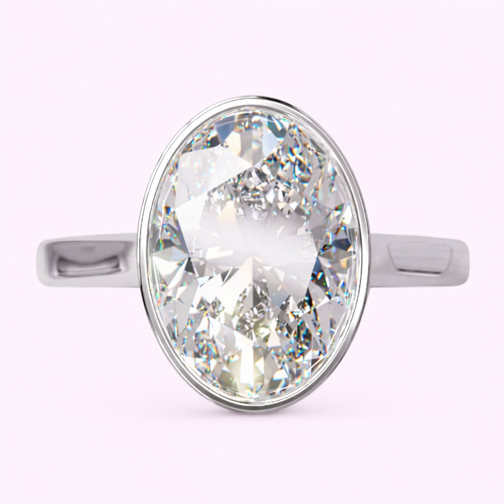 Oval bezel set lab diamond ring 2.50ct Raye design in polished yellow gold UK independent jewellers