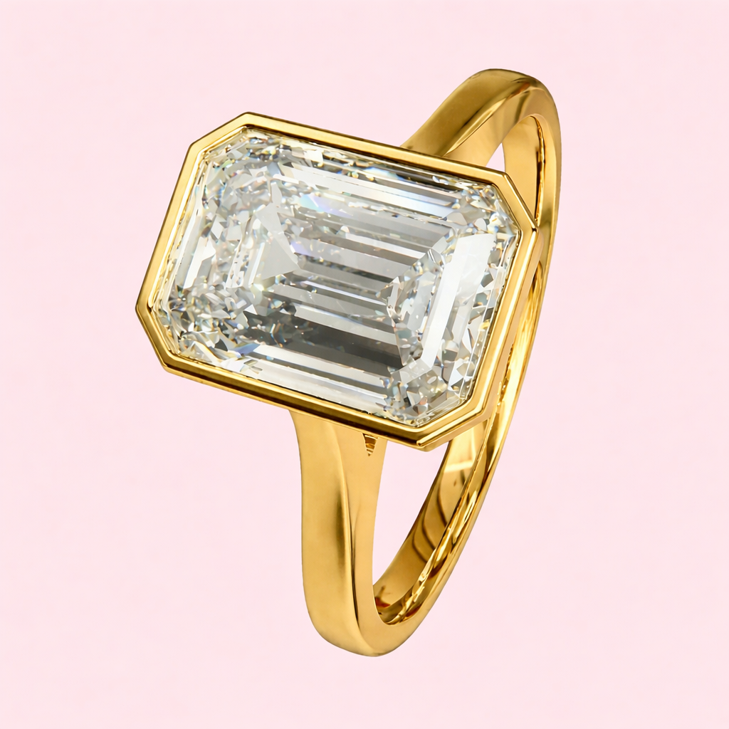 Luxury emerald cut lab diamond engagement ring Margot 2.50ct bezel set in yellow gold UK independent jewellers
