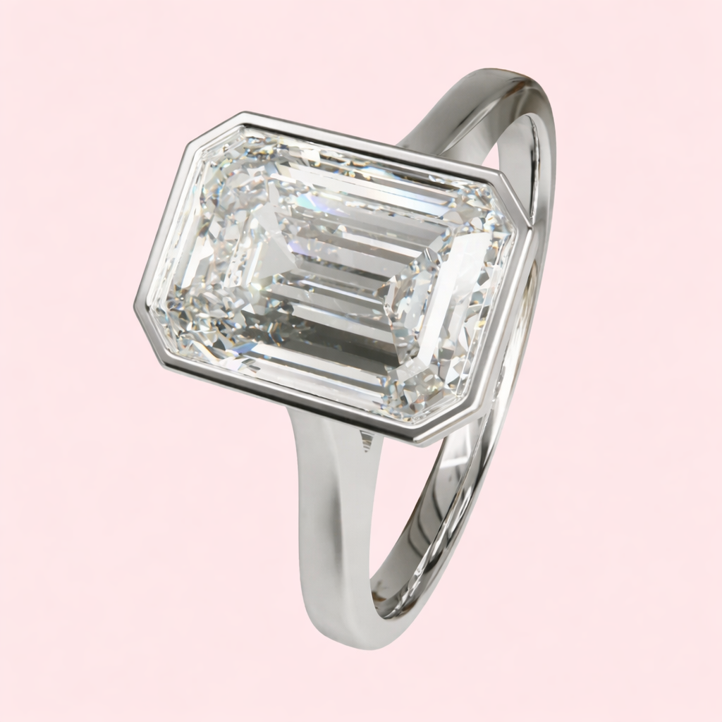 Margot 2.50ct emerald cut lab grown diamond bezel engagement ring in yellow gold by Fogal and Barnes Harrogate