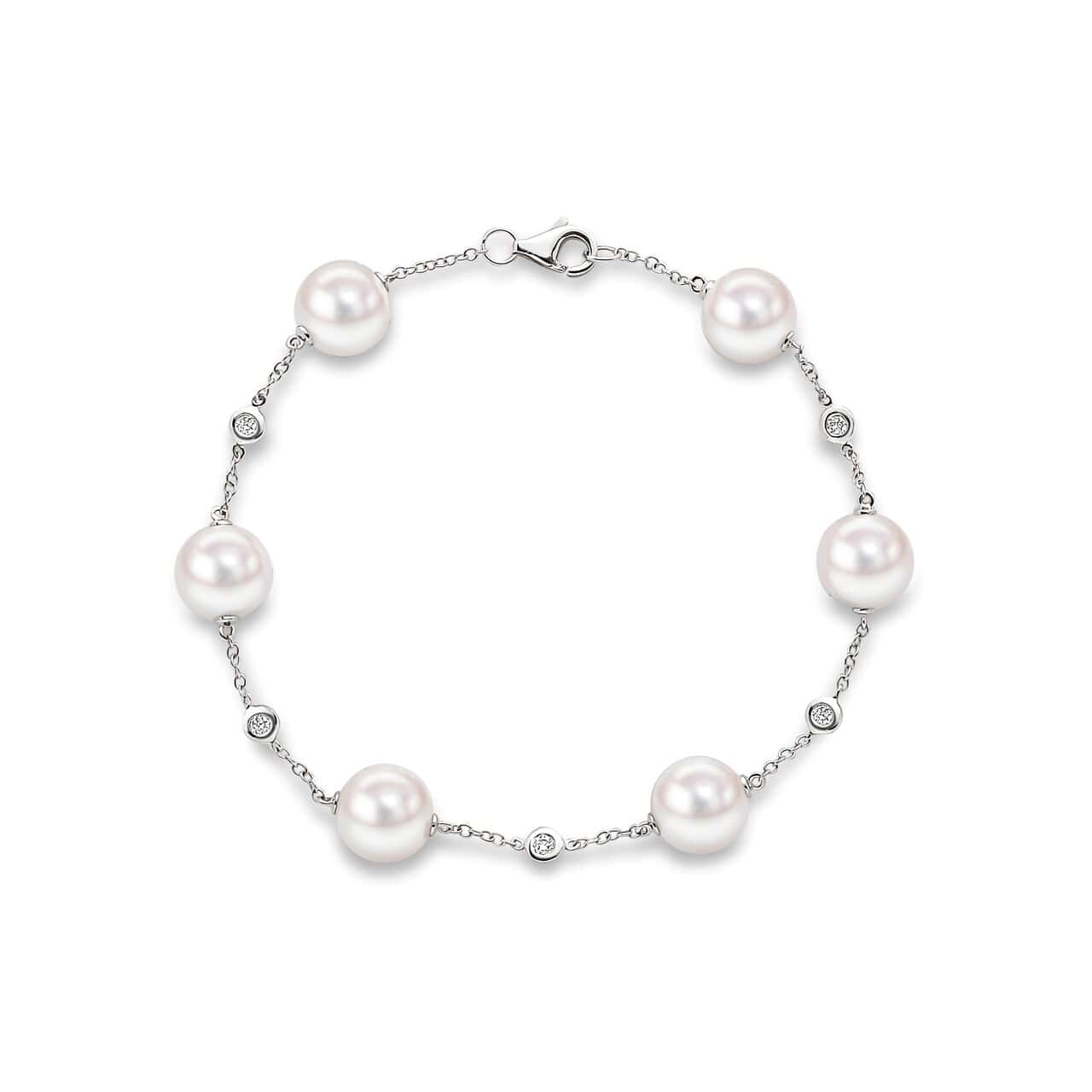 Akoya pearl and diamond station bracelet in 18ct white gold, six 8.5–9mm white Akoya pearls with bezel-set brilliant diamond stations on rolo chain, 7.5 inches