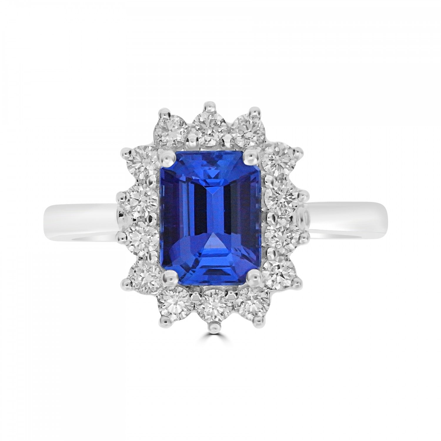 Emerald cut tanzanite with diamond cluster engagement ring Harrogate. Fogal and Barnes Fine Jewellers set in 18ct white gold or platinum