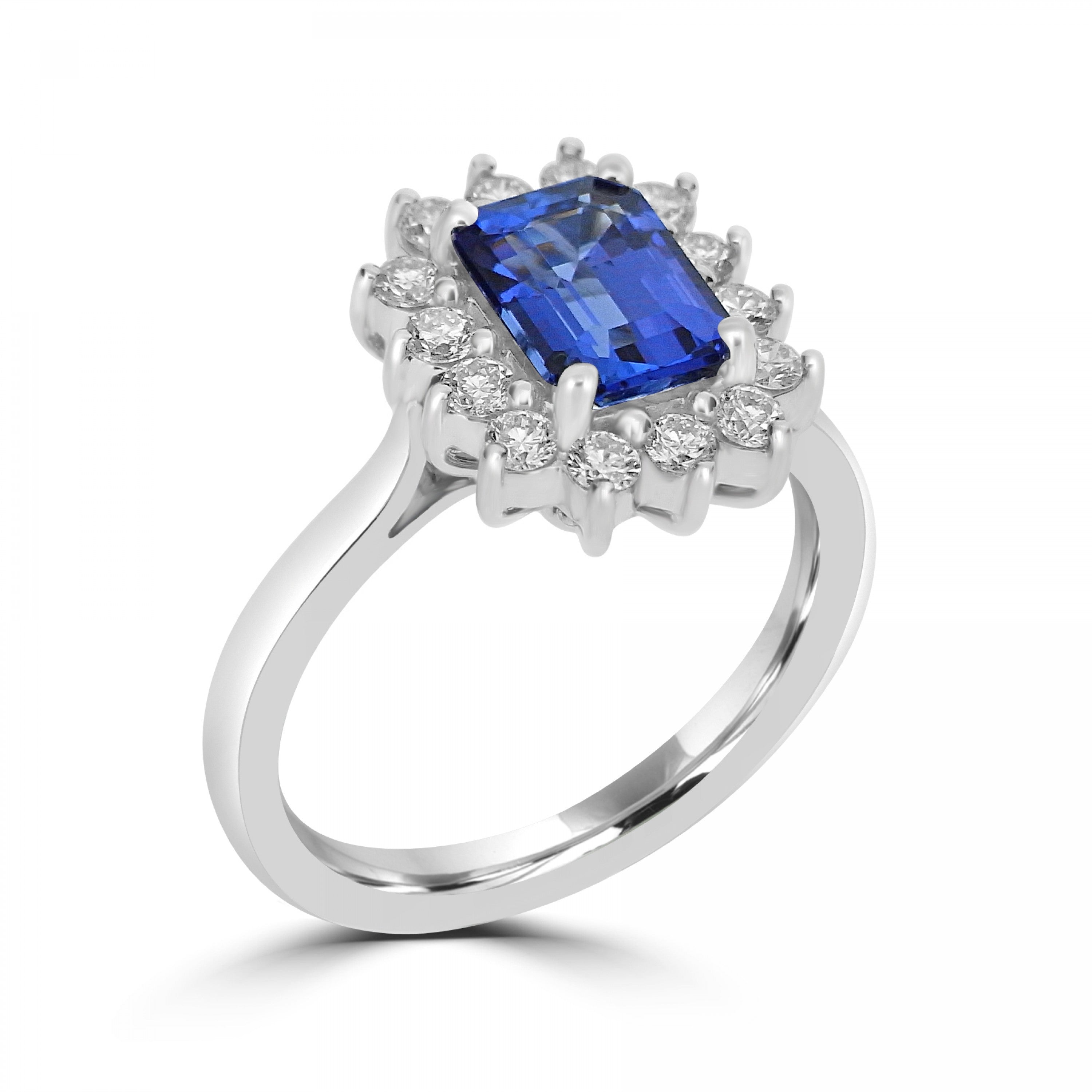 Emerald cut tanzanite with diamond cluster engagement ring Harrogate. Fogal and Barnes Fine Jewellers set in 18ct white gold or platinum