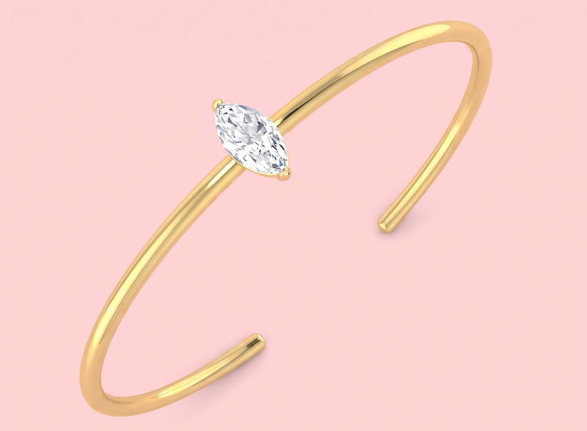 Lab-grown marquise cut diamond solitaire open bangle featuring a 1.02ct E/VS2 centre stone shown in yellow gold