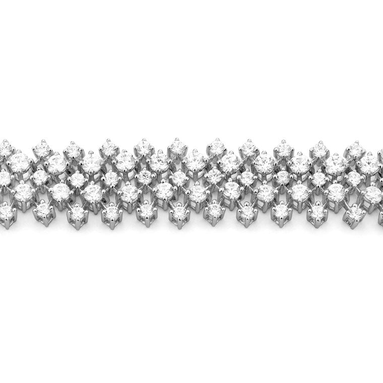 Close-up wide multi-row white gold diamond cascade necklace featuring 628 round brilliant diamonds totalling 12.5ct, shown flat and draped on white background