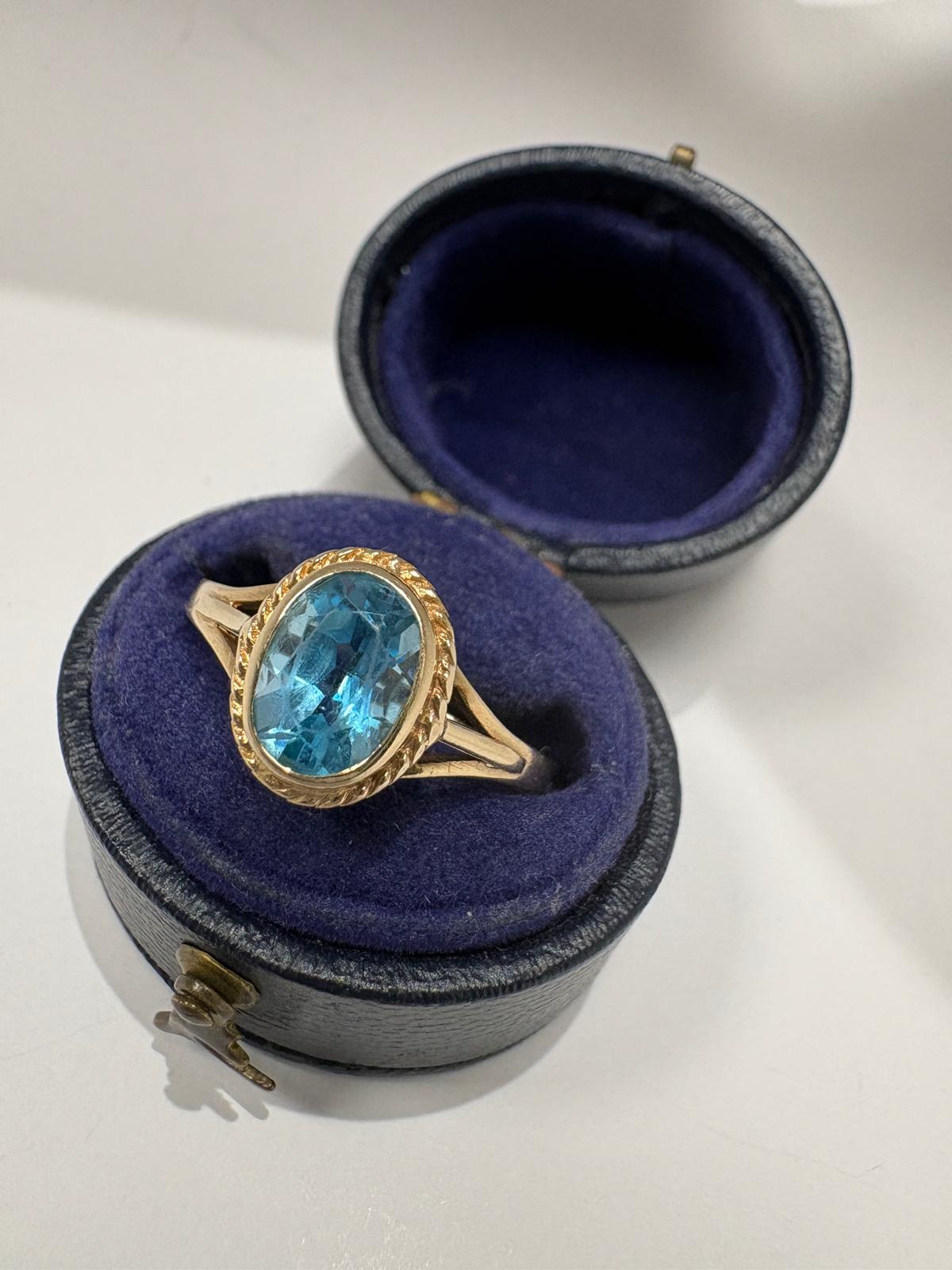 9k Yellow gold bezel oval ring blue topaz size R