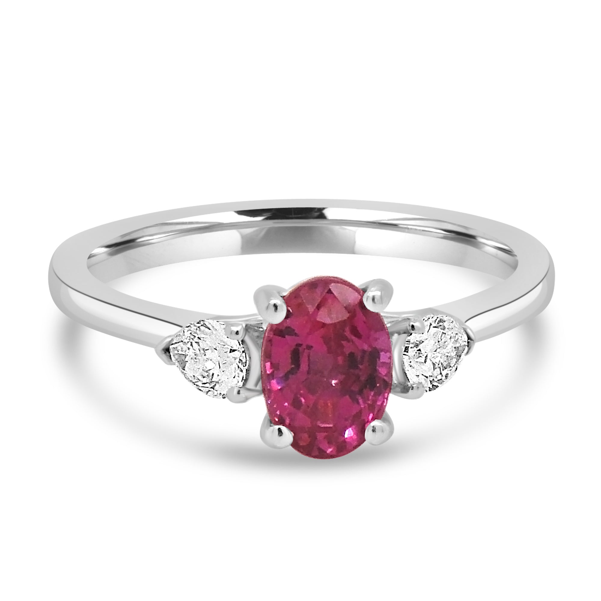 Oval pink sapphire and diamond pear three stone engagement ring set on platinum from fogal and barnes fine jewellers of Harrogate