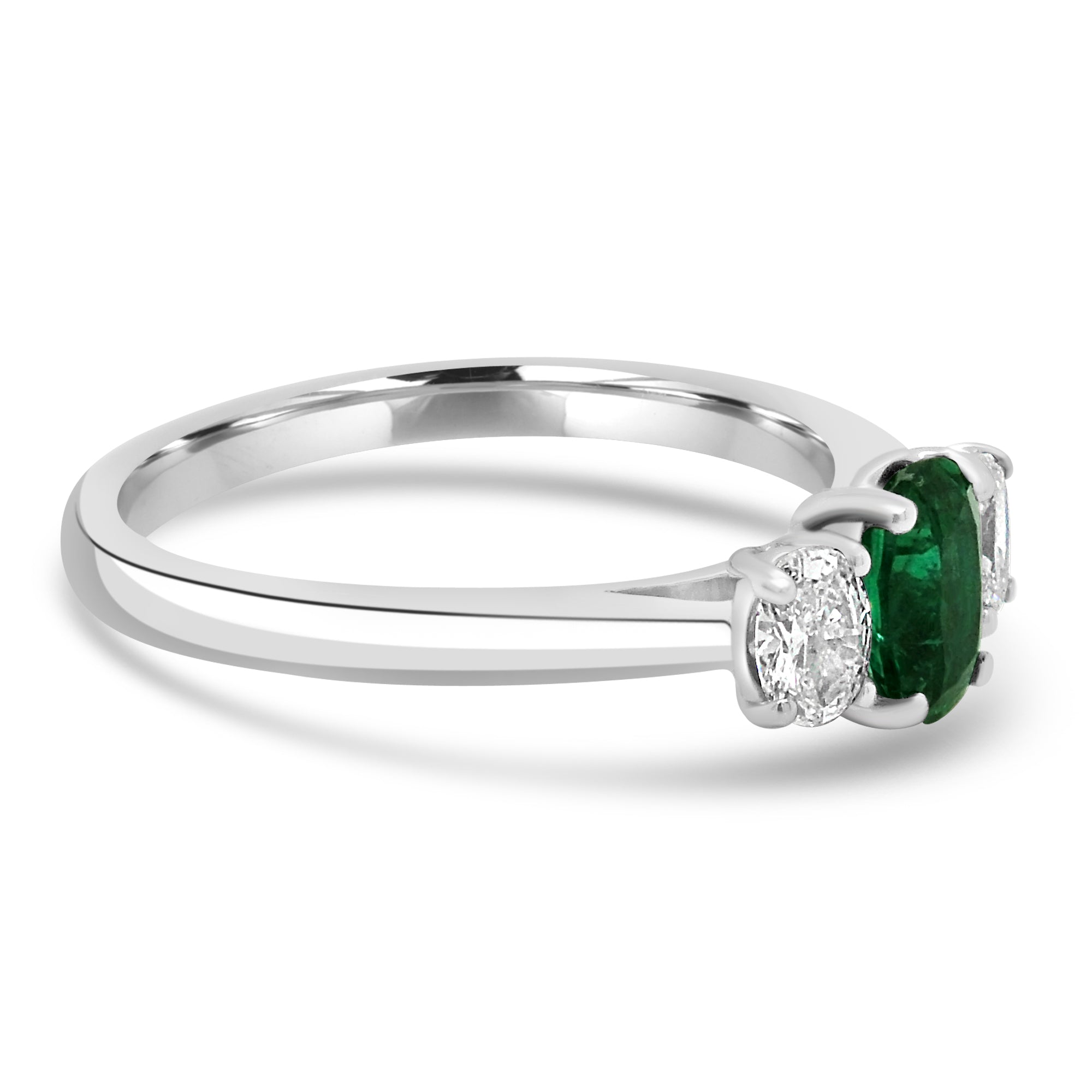 Oval cut emerald and diamond three stone engagement ring set on platinum from fogal and barnes fine jewellers of harrogate.