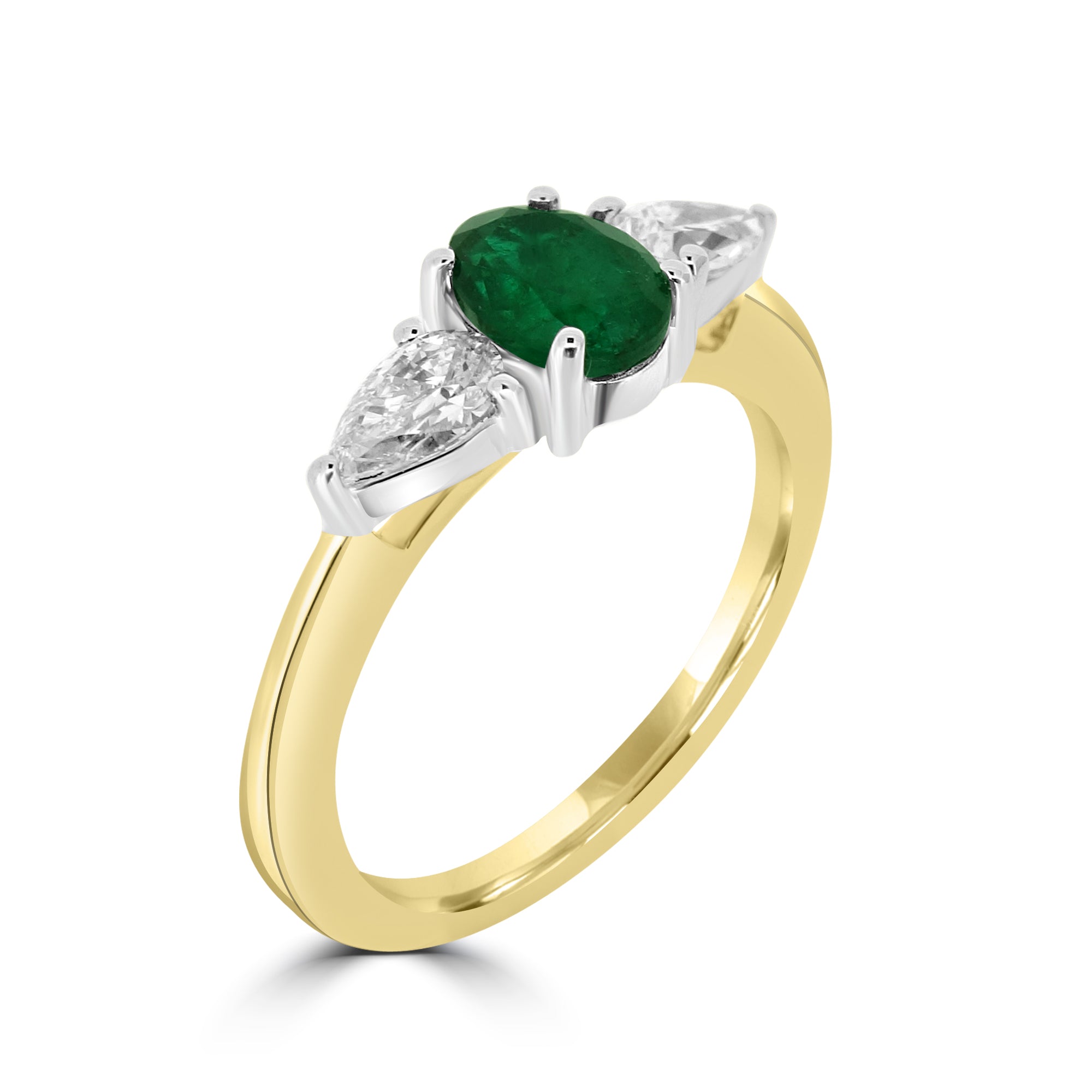 oval cut center emerald and diamond side pear cut three stone engagement ring set on 18k yellow gold from fogal and barnes fine jewellers of harrogate.