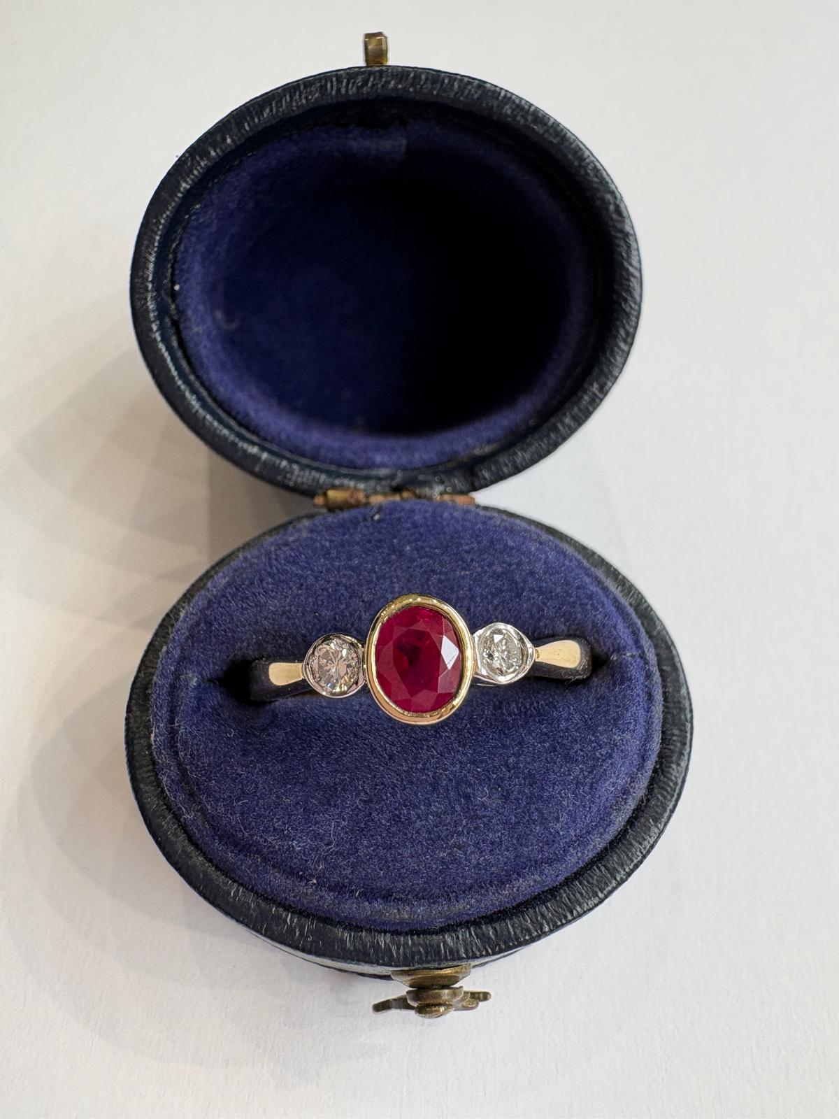 ruby and diamond ring, bezel set ruby ring, two tone gold ruby ring, second hand ruby ring UK, pre-loved three stone ring, vintage ruby diamond ring, 9ct gold ruby ring, ruby diamond trilogy ring, second hand jewellery Harrogate, second hand jewellery Leeds, second hand jewellery York, second hand jewellery Yorkshire, pre-owned ruby ring UK, bezel set gemstone ring, buy second hand ruby ring, ruby ring size N, ruby ring near me, fine jewellery Harrogate, pre-loved jewellery Yorkshire