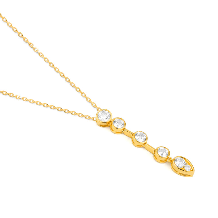Yellow gold bezel set diamond drop pendant necklace featuring five graduating diamonds finishing in a pear shape, on a 42cm chain, shown on white background side view