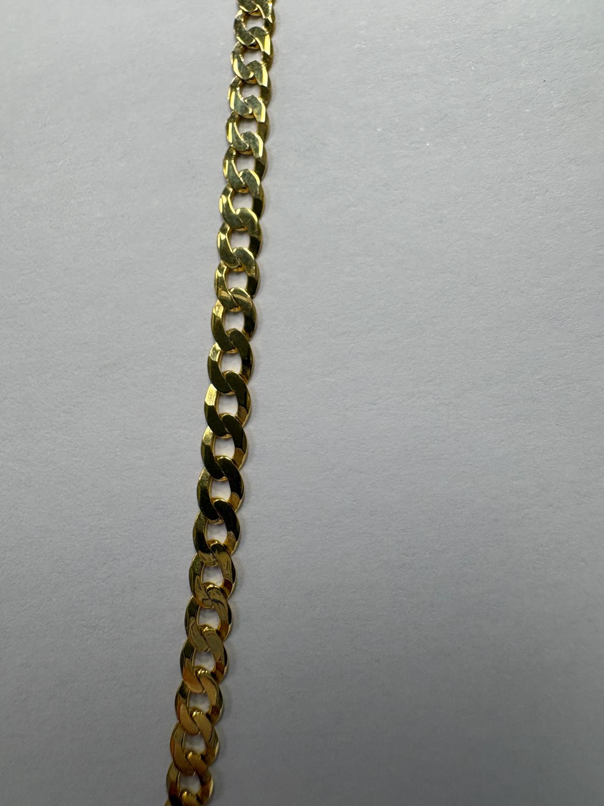 Close-up detail of a pre-loved yellow gold curb chain necklace showing the individual flat interlocking curb links. The bevelled edges of each link catch the light, creating a continuous shimmer along the length of the chain.