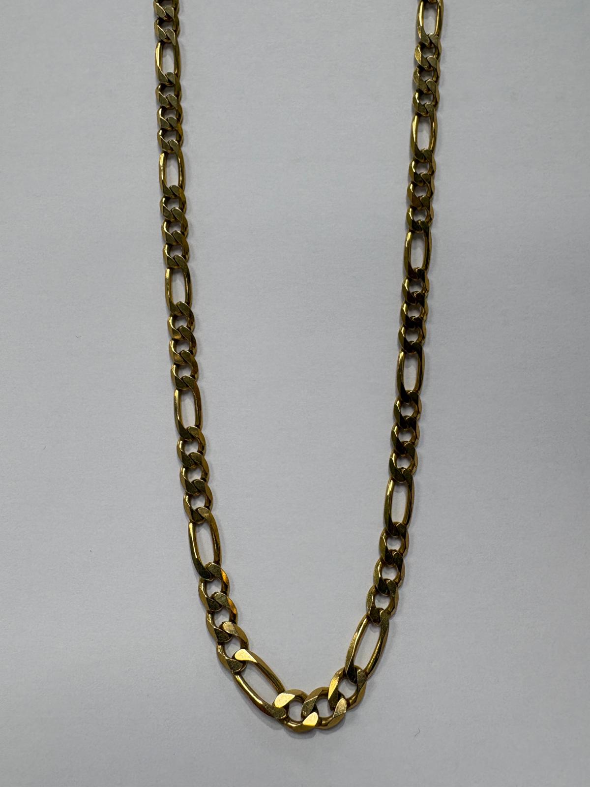 Full length front view of a pre-loved yellow gold heavy figaro chain necklace laid flat on a grey background. The chain features a bold figaro link pattern of three small curb links alternating with one elongated oval link throughout.