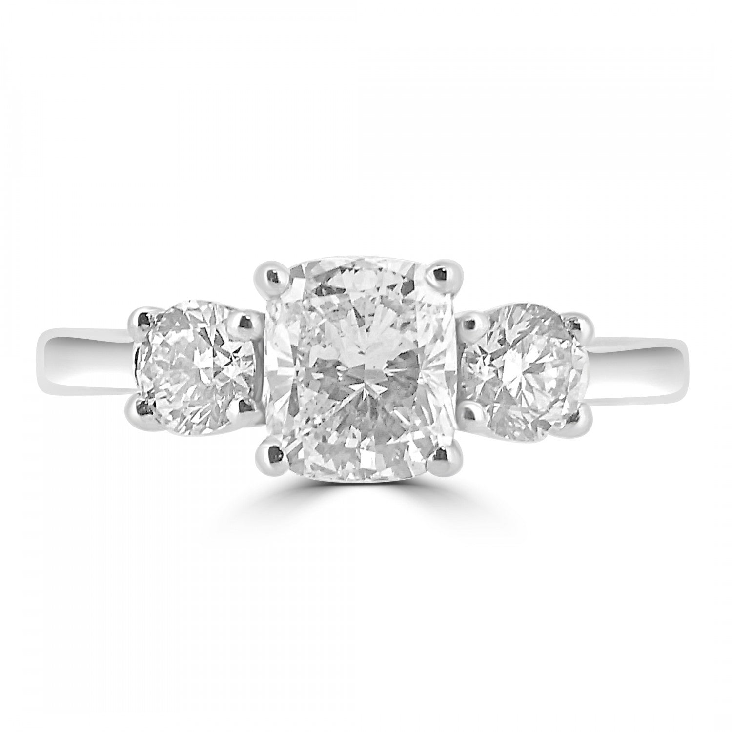 Cushion cut natural diamond trilogy engagement ring harrogate, set on 18ct white gold or platinum. Fogal and Barnes Fine Jewellers