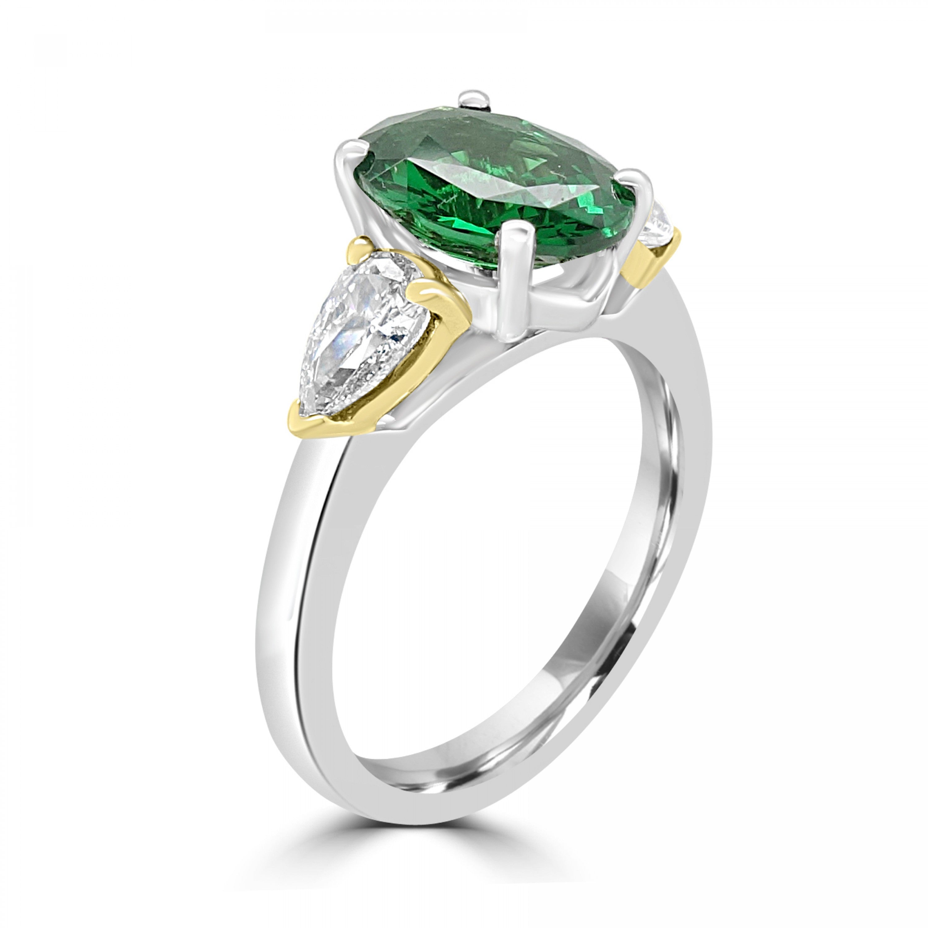Oval Cut Emerald and pear cut yellow diamond three stone from fogal and barnes fine jewellers of harrogate set on platinum with 2 side yellow gold metal