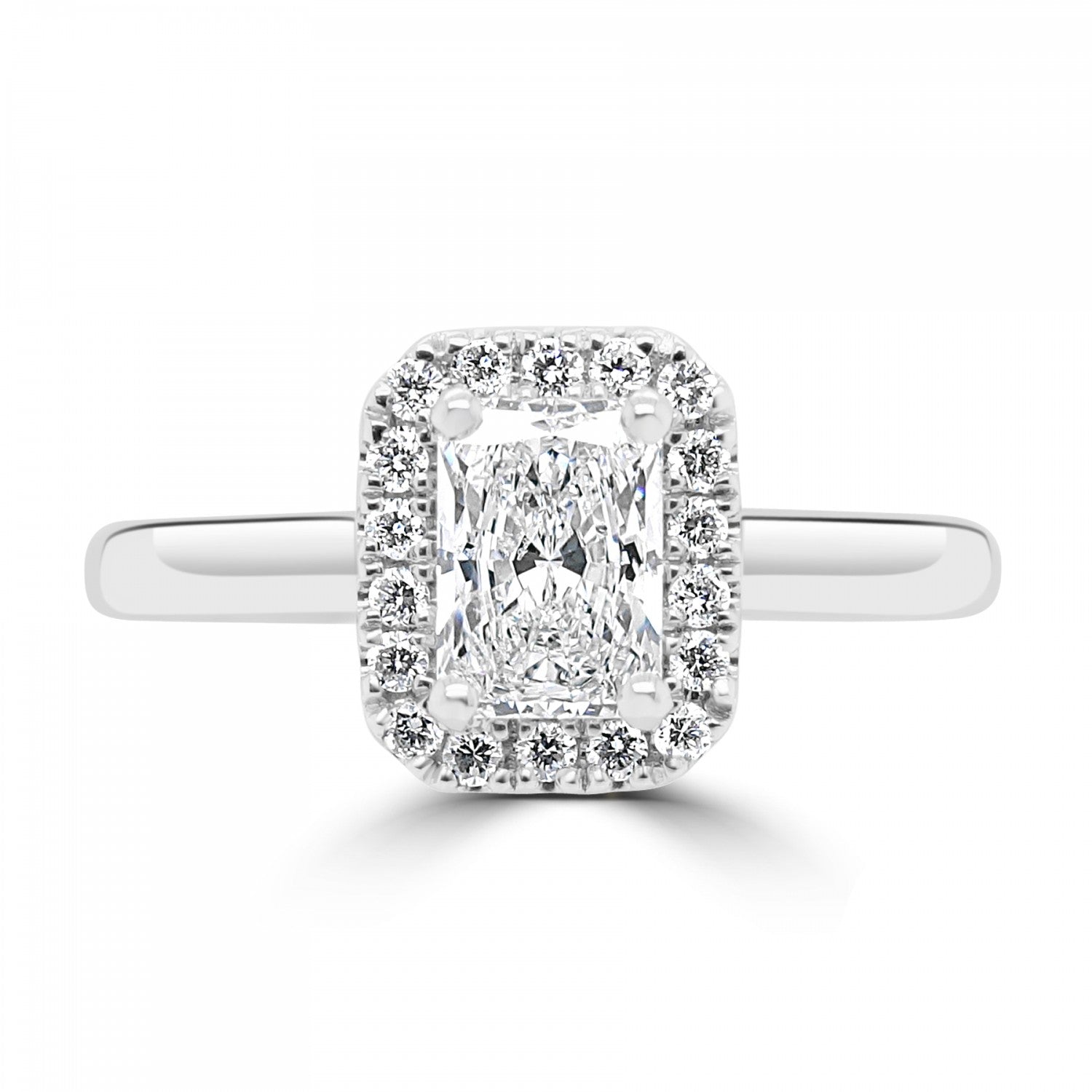 Radiant cut diamond halo engagement ring set on 18ct white gold or platinum. Fogal and Barnes Fine Jewellers of Harrgate