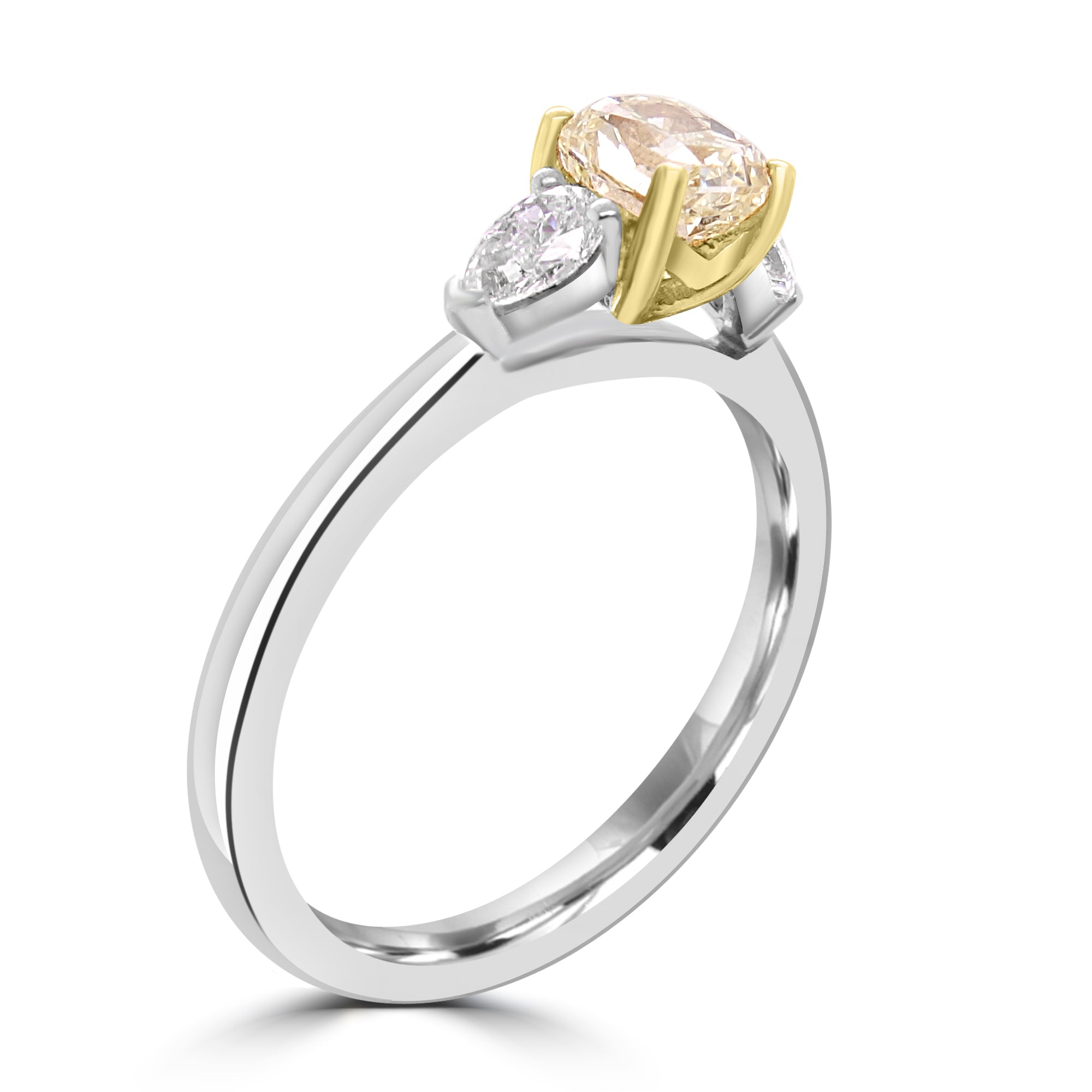 Radiant cut fancy yellow diamond three-stone ring in platinum and gold